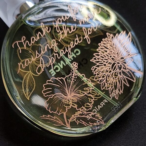 chancel chance bottle engraved with calligraphy and hibiscus flowers