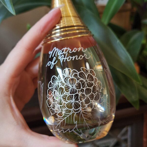 J'adore Dior perfume bottle engraved with Matron of Honor in calligraphy with hydrangea flowers