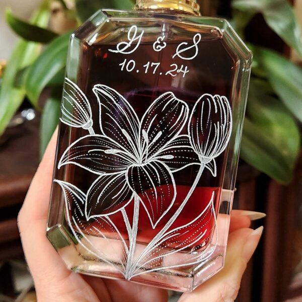 Kayali vanilla perfume bottle hand engraved with lilies and wedding date