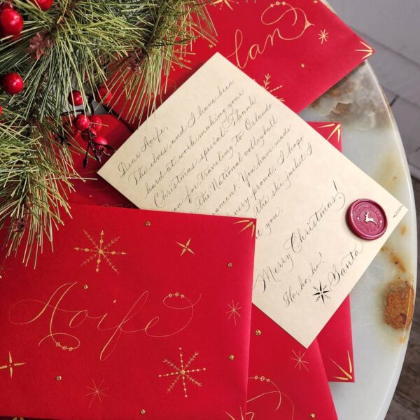 personalized Santa Letters with calligraphy on parchment and decorated red envelopes