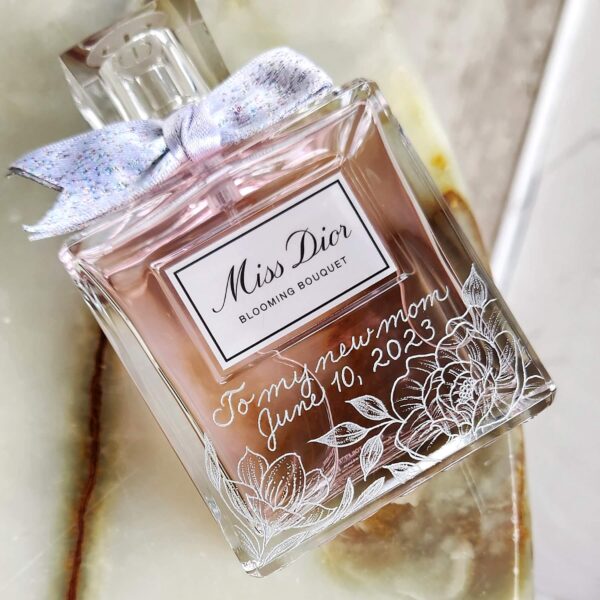 Dior perfume hand engraved with calligraphy and flowers with wedding date