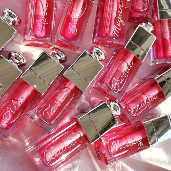 Dior lip oils hand engraved with bridesmaid names in silver calligraphy