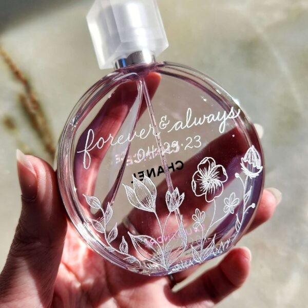 chanel chance perfume bottle with hand engraved wildflowers and calligraphy on the back