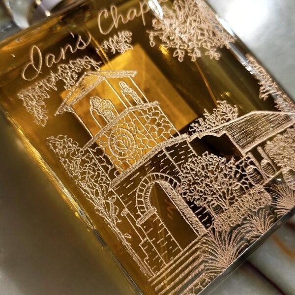 engraved chanel perfume bottle with wedding venue illustration Ian's Chapel on the back in gold